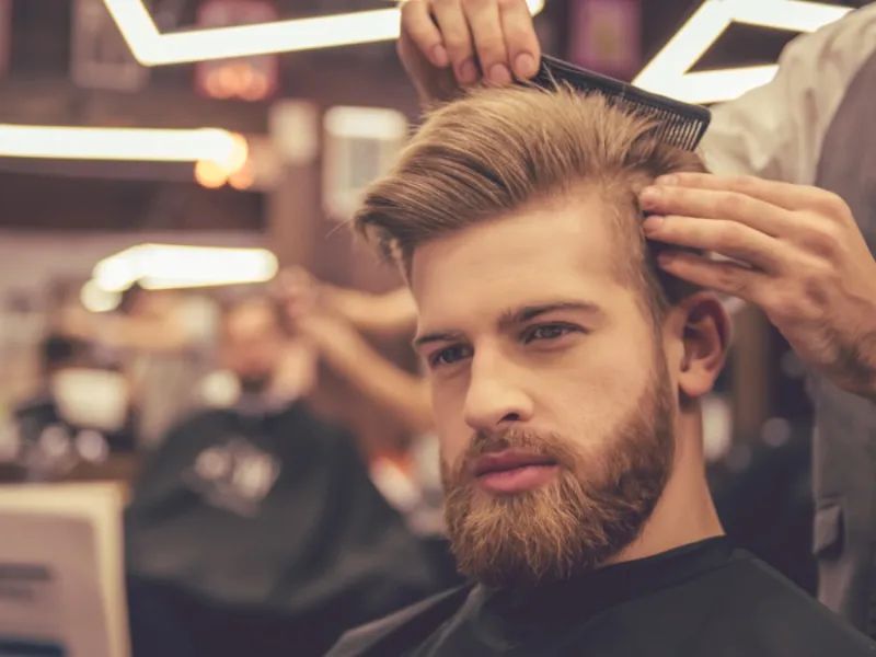 “Popular long hairstyles for modern men including man bun and layered hair”