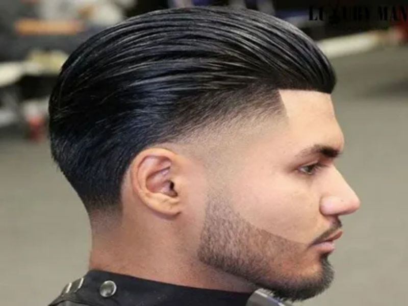 Low fade with curly top hairstyle for black men