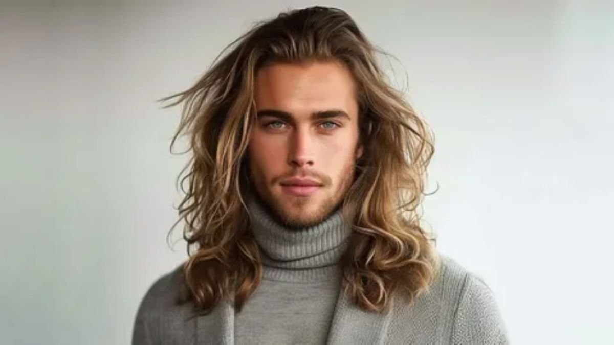 Stylish man with long curly hair hairstyle for men in 2026